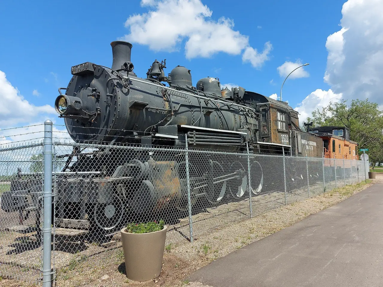 Preserved steam locomotive and caboose, 2021