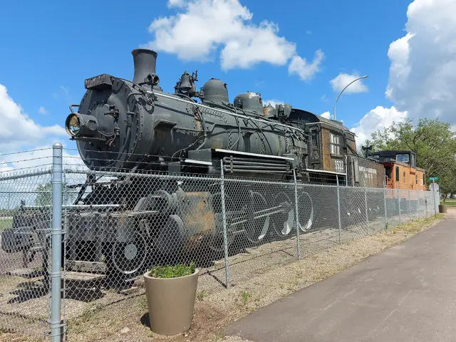 Preserved steam locomotive and caboose